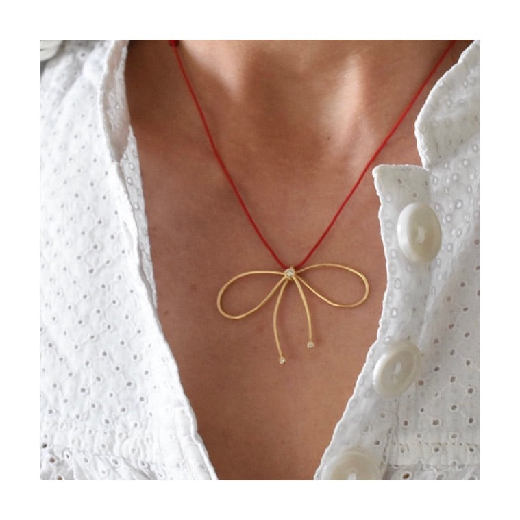 Aimée Aimer Nœud de Paris collier or jaune diamants bleu marine